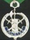 There are up to three Trustees in each Council, titled as 1 Year Trustee, 2 Year Trustee, and 3 Year Trustee. They oversee the financial transactions of the Council, review all bills and financial reports and audit the Council's financial records semi-annually. Their jewel is the Crossed Key and Sword, which represents their financial authority. 	
